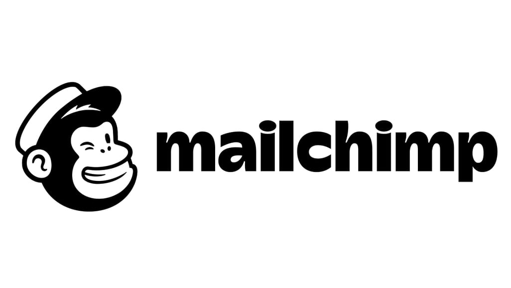 Mailchimp logo featuring a smiling chimpanzee wearing a hat.