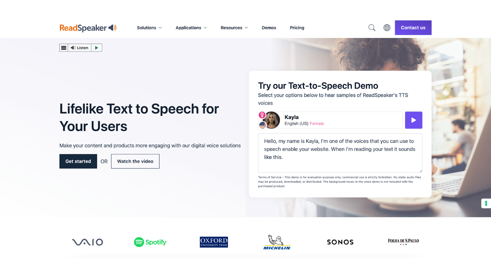 Screenshot of the ReadSpeaker website featuring a text-to-speech demo with a woman in the background and a speech sample from a voice named Kayla.