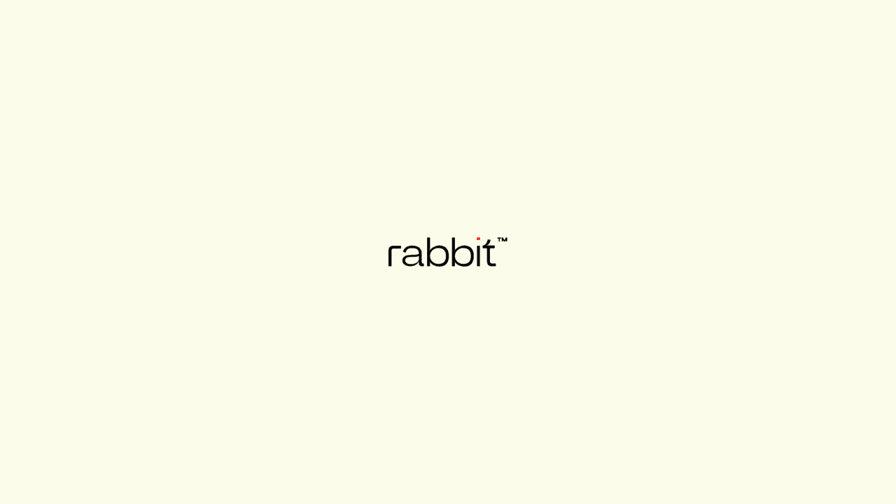 Alt text: The word "rabbit" with a small red dot above the letter "i" on a light background.